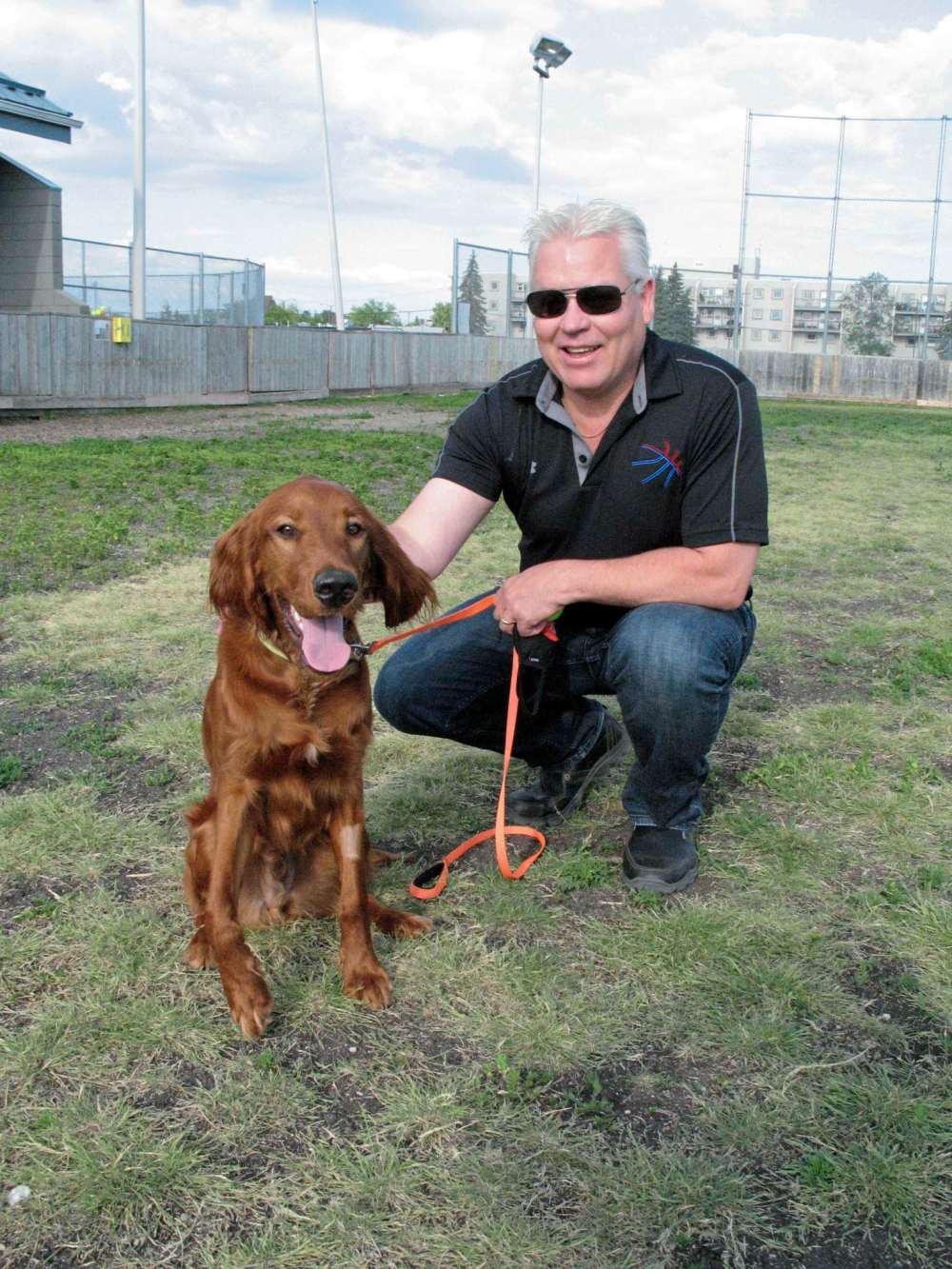 Photo by Simon Fuller
Rodger Salm is pictured here with his dog, Scout. Salm, a new board member at Winakwa Community Centre, was one of the organizers of a new off-leash dog park at the Windsor Park-based centre. The park is located in what is one of the centre’s two fenced-in ice rinks during the winter.