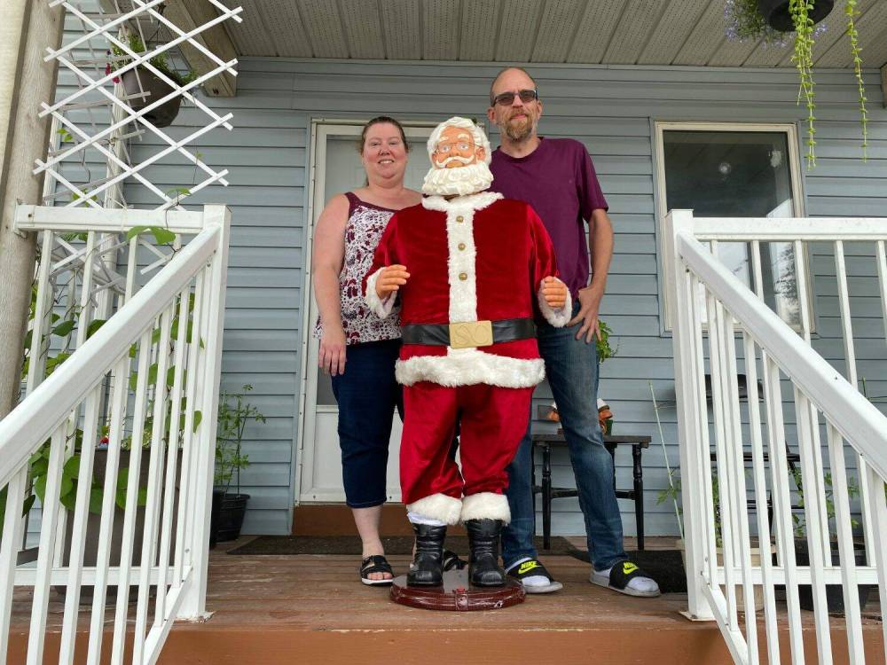 Nicole and Richard Holm are the caretakers of Santa on Nairn Ave. The iconic East Elmwood statue, located at 641 Nairn Ave., was recently vandalized beyond repair. However, a grassroots GoFundMe campaign has replaced the statue and covered costs of installing security cameras to keep an eye on Saint Nick.
