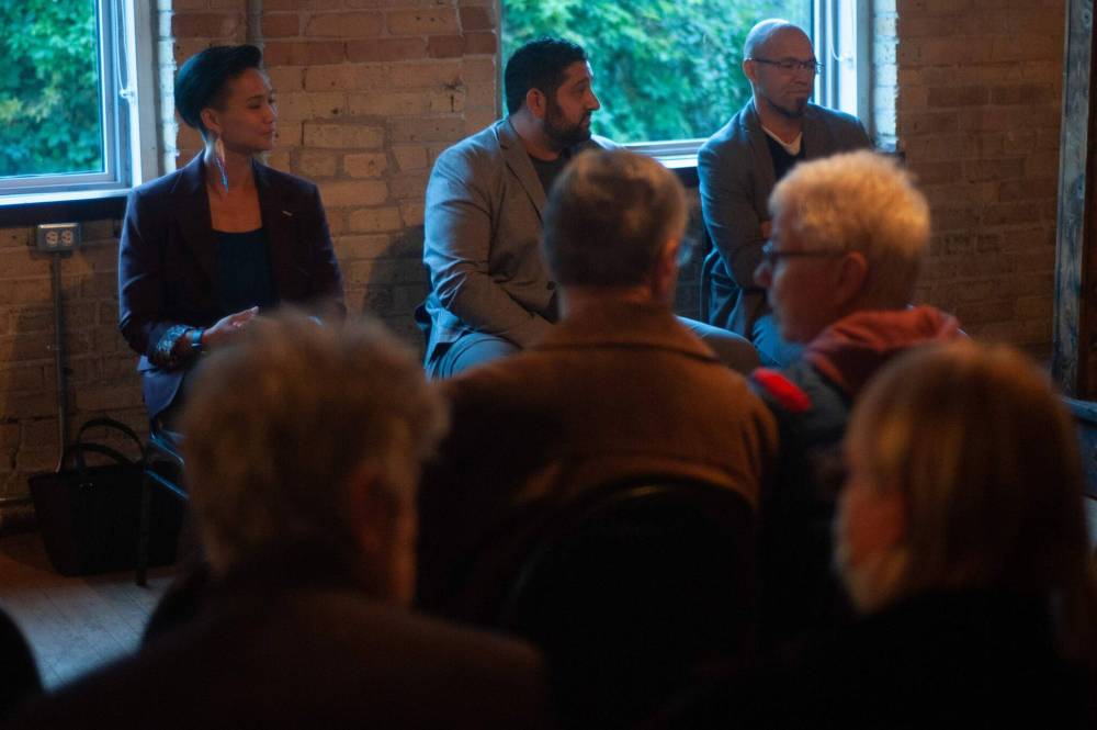 The three city council candidates for Point Douglas wait for the forum to begin.