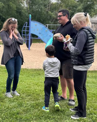 Supplied photo
                                Kildonan-River East MLA Rachelle Schott at recent community barbecue greeting excited student who recognized her from I Love to Read Month.