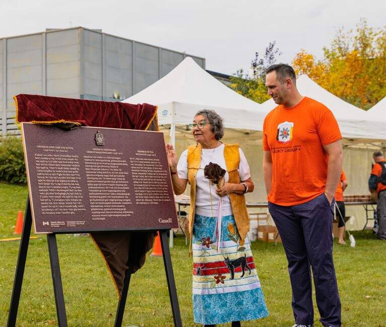 Supplied photo
Elder Mabel Horton and Winnipeg South Centre MP Ben Carr unveil the Historic Sites and Monuments Board of Canada plaques commemorating the former Assiniboia Residential School on Sept. 30.