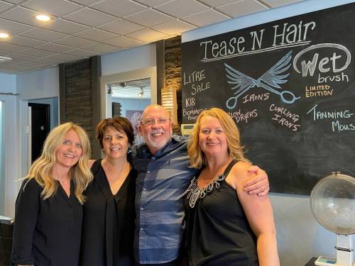 Supplied photo
                                Gord Dillon (third from left) is the proprietor of the salon Tease’n Hair company, located at 3104 Portage Ave.