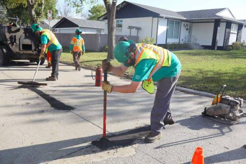 Supplied photo
                                Repairing potholes is just one of the many tasks tackled by the Neighbourhood Action Team during its time in Old Kildonan ward.