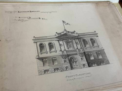 Photo by Emma Honeybun
                                An original sketch of the Carnegie Library, designed by architect Sam Hooper — one of eight original designs created for consideration by the contractors tasked to build the structure 120 years ago. The Carnegie Library was the first public library in Winnipeg — funded by a grant from Andrew Carnegie, who funded over 2,500 libraries worldwide. It currently sits vacant, but will be renovated and is projected to reopen in 2027.