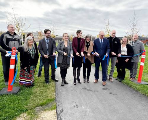 Supplied photo
                                Windsor Park residents and local politicians recently marked the opening of O Mikina Kiija Moosayan, connecting Winakwa Community Centre with a community garden, outdoor classroom, and recreation spaces.