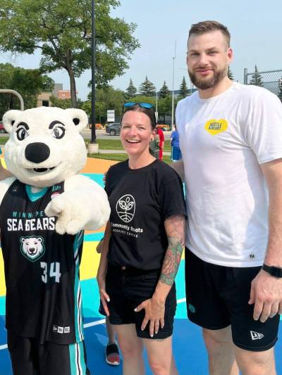 Supplied photo
                                Rossmere MLA Tracy Schmidt and the late Chad Posthumus (at right) crossed paths at a few basketball-related events.