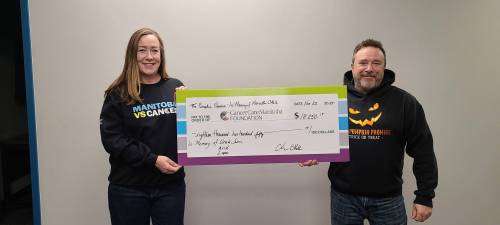 Supplied photo
                                Pictured, from left: CancerCare Manitoba’s Donna Laurin is presented with a cheque by Chris Okell.