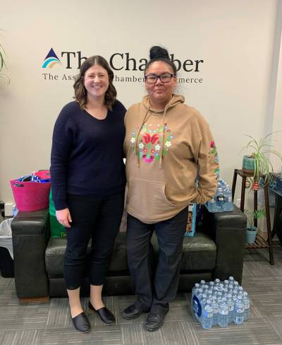 Supplied photo by Rayel Smoke
                                Amanda Gibson of the Assiniboia Chamber of Commerce is pictured with Tannis Smoke of the Blessing Bags drive, who came by to pick the Chamber&rsquo;s donations of reusable water bottles, snacks, bottled water, feminine hygiene products, toothpaste, toothbrushes, deodorant and various pieces of clothing.