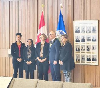 Photo by Dylon Martin
                                (From left) Winnipeg city councillors Vivian Santos (Point Douglas), Devi Sharma (Old Kildonan), Emma Durand-Wood (Elmwood-East Kildonan), Mayor Scott Gillingham, and Coun. Janice Lukes (Waverley West), pictured at the Oct. 30 swearing-in ceremony of Durand-Wood.