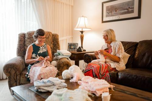 Supplied photo
                                Pictured, from left: Lorena Penner and Ruby Tretiak are pictured creating items for the Manitoba Angel Dresses group.