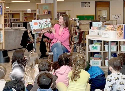 Supplied photo
                                Rossmere MLA Tracy Schmidt reads to a classroom of students during I Love to Read month last February.