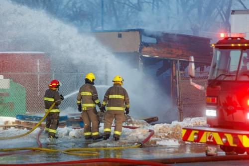 Mike Deal / Free Press
                                Winnipeg Fire and Paramedic Service crews work at putting out a fire at 45 Archibald St. last week.