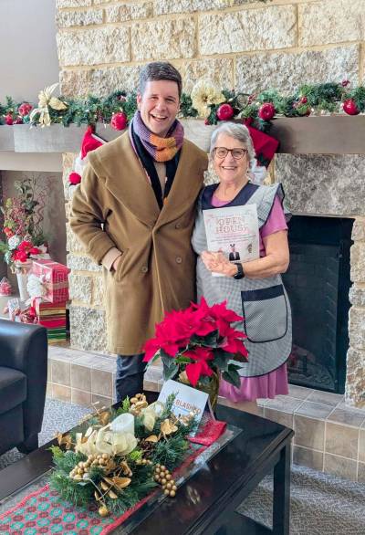 Supplied photos
                                Lagimodière MLA Tyler Blashko made many impromptu connections while dropping off poinsettias in December.