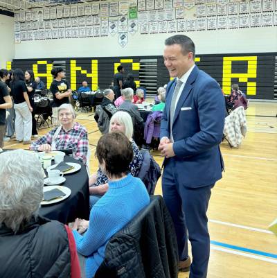 Supplied photo
                                Riel MLA Mike Moyes, minister of environment and climate change, shared some laughs during Dakota Collegiate&rsquo;s seniors night