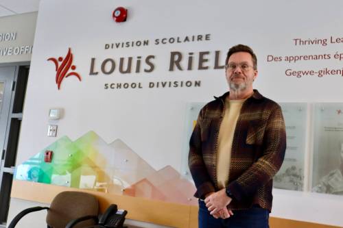 Photo by Emma Honeybun
                                Christian Michalik, Louis Riel School Division superintendent and CEO, pictured here at the division&rsquo;s board office recently, is set to officially retire in August, after 37 years working in public education.