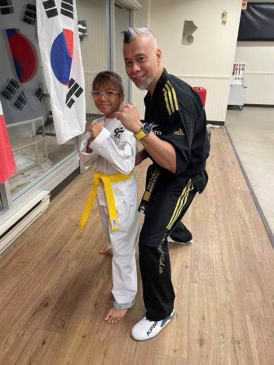 Photo by Simon Fuller
                                Sunthaya Chea (left) is pictured with Julius Bañares, Elite Taekwondo&rsquo;s owner. Bañares said he hopes for Chea&rsquo;s participation in the sport will inspire others and lead the way for other local athletes, in the same way she&rsquo;s an example to other club members.