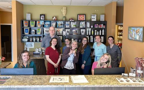 Supplied photo
                                Dr. Andrew Davidson (at back), Dr. Julia Joshi (back row, far right) and the staff of Whyte Ridge Veterinary Hospital. Caring for animals is their passion.