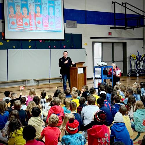 Supplied photo
                                Kirkfield Park MLA Logan Oxenham reads The Golden Goal, by Matthew Cade, to students Sansome School.