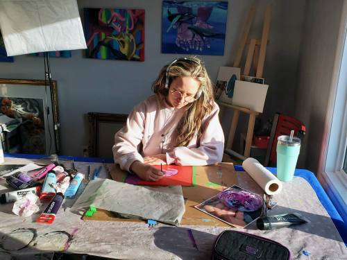 Supplied photo
                                Artist Cori Jaye Ettienne is pictured in creative mode in her home studio. The St. Vital resident is participating in Mentoring Artists for Women&rsquo;s Art&rsquo;s 22nd annual Over the Top Art Auction and Cupcake Party, which will be held on April 12 from 1 to 5 p.m. at 329 Cumberland Ave.