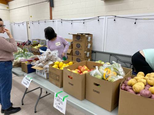 Supplied photo
                                Volunteers prepare for a barrier-free food giveaway at the Elmwood-East Kildonan Active Living Centre.