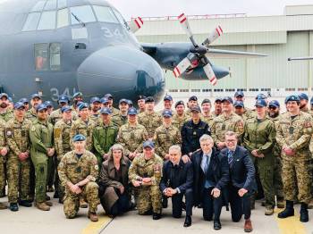 Supplied photo
                                Winnipeg West MP Doug Eyolfson (kneeling, far right) joined finance minister François-Philippe Champagne (third from right, ) Winnipeg South MP Terry Duguid (second from right), Saint Boniface – Saint Vital MP Ginette Lavack, (second from left) and members of the Royal Canadian Air Force at a recent defence announcement at 17 Wing Winnipeg related to the government&rsquo;s spring economic update.