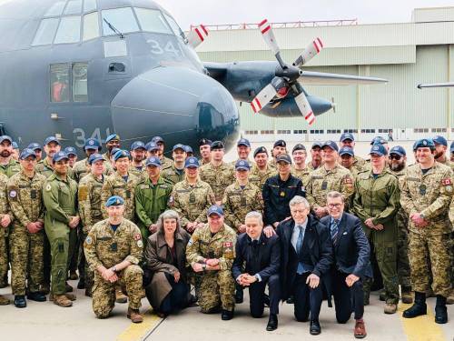 Supplied photo
                                Winnipeg West MP Doug Eyolfson (kneeling, far right) joined finance minister François-Philippe Champagne (third from right, ) Winnipeg South MP Terry Duguid (second from right), Saint Boniface – Saint Vital MP Ginette Lavack, (second from left) and members of the Royal Canadian Air Force at a recent defence announcement at 17 Wing Winnipeg related to the government&rsquo;s spring economic update.