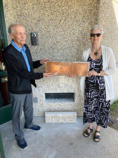 Photo by Sheldon Birnie
                                Denis Gautron, the first principal at École Julie-Riel, and Jeannette Beaudry, the school&rsquo;s first kindergarten teacher, opened a time capsule on May 13 which had been placed behind a stone in the wall during the school&rsquo;s first year of operation (1996-97).