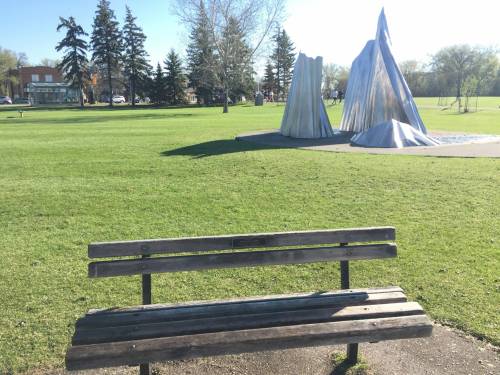 Photo by Fred Morris
                                Tom Bjarnason, a well-known illustrator has a memorial bench in Assiniboine Park near Gordon Reeve&rsquo;s Agassiz Ice cculpture.