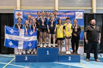 Photo by Table Tennis Canada
                                U-15 team athletes Alexus Lee, Rhea Liu, and coach Nury Vasquez on the podium where they finished with a silver medal at the 2025 Canadian Championships in Richmond, B.C.