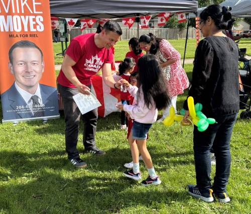 Supplied photo
                                Hon. Mike Moyes, Minister of Environment and Climate Change and MLA for Riel, at the Canada Day Celebration put on by the River Park South Community Association at Highbury School.