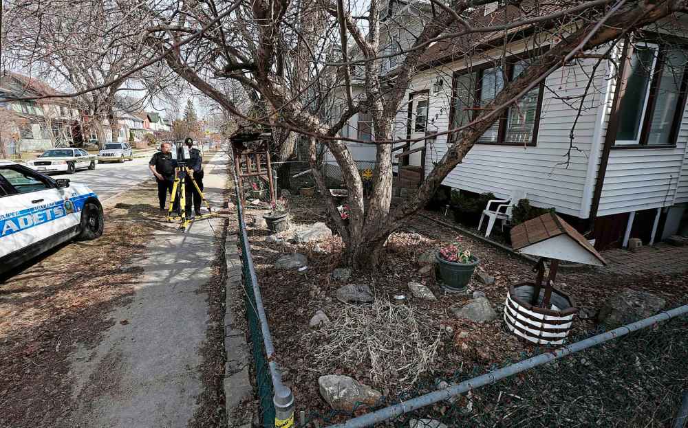 WAYNE GLOWACKI / WINNIPEG FREE PRESS
Winnipeg Police and Cadets at the taped off scene in 400 block of Camden Place Tuesday morning. On April 10, at approximately 3:10 a.m., Winnipeg Police responded to a call and located a female in her fifties suffering from serious upper body injuries. The victim was pronounced deceased at the scene. The house at right is 495 Camden Place. Bill Redekop story April 11 2017