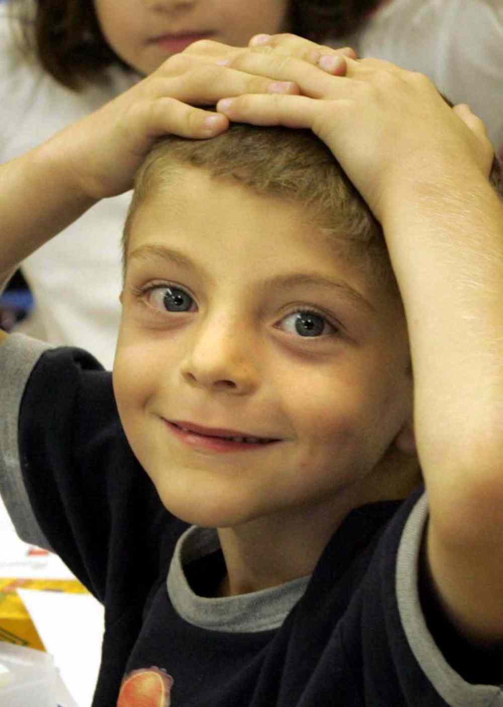 Mason has hands on his head along with all his classmates waiting for instructions from Mrs. Lauranne Moir. (Wayne Glowacki / Winnipeg Free Press)