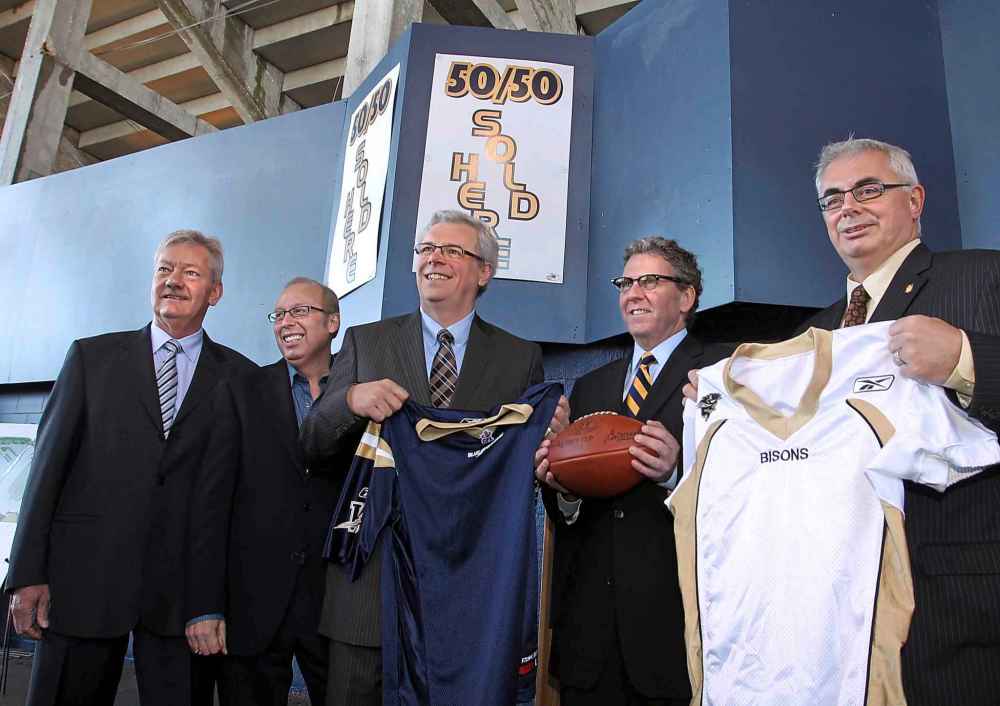 wayne Glowacki / Winnipeg Free Press files
From left Ken Hildahl, Chair, Board of Directors of the Winnipeg Football Club, Mayor Sam Katz, then-premier Greg Selinger, David Asper, Executive Chairman of Creswin Properties Inc. and David Barnard, president of the University of Manitoba pose for pictures after the announcement of a plan to accelerate the construction the stadium.