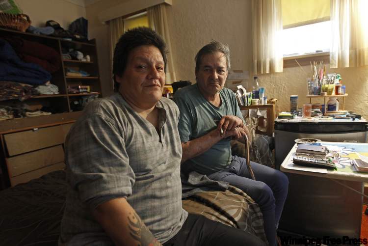 TREVOR HAGAN / WINNIPEG FREE PRESS
Curtis Mainville (left) and Charlie Thorgrimson mourn death of Ian MacDonald.
