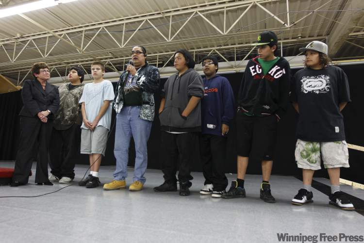 TREVOR HAGAN / WINNIPEG FREE PRESS
Mayoral candidate Judy Wasylycia-Leis looks on as Lionel Houston and members of his Circle of Courages take the stage during a vigil held at the Indian Metis Friendship Centre on Robinson Street Monday night.