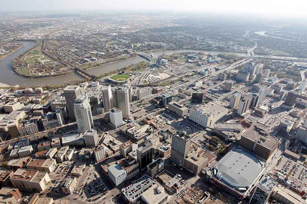 TREVOR HAGAN/WINNIPEG FREE PRESS files
Aerial view of downtown Winnipeg, including Portage and Main, Shaw Park, Esplanade Riel, The Forks, The Canadian Museum for Human Rights and Bell MTS Place. Winnipeg means