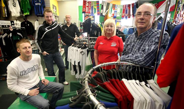 Phil Hossack / Winnipeg Free Press
Christine and Cavan O'Connor and their three sons, Dylan (from left), Brad and Adam, in Winnipeg's iconic soccer store, The Sweat Shack. The family has run the store for 32 years.