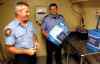 Boris Minkevich / Winnipeg Free Press
Jay Simons and Dale Worrall of the Winnipeg Fire Paramedic Service with water jugs the WFPS is handing out.