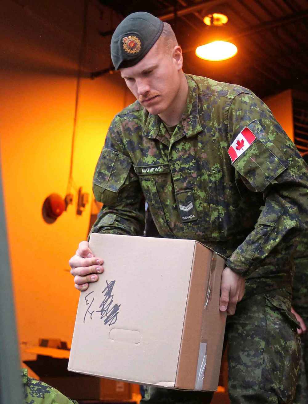 WINNIPEG FREE PRESS FILES
Patrik Mathews loads up boxes of food, gifts and turkeys from the Christmas Cheer Board to deliver to families in need in 2015. The Free Press has identified Master Cpl. Patrik Mathews, 26, as the man responsible for the neo-Nazi propaganda posters that have been posted throughout the city in recent weeks.