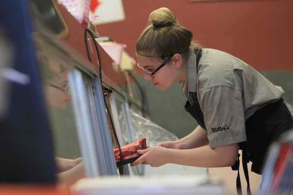 RUTH BONNEVILLE / WINNIPEG FREE PRESS 2017 Project: Grade 11, Glen Lawn student, Mackenzie, spends her spare time working at Millers Meats. She is one of a group of students from Windsor School that the Free Press has been following throughout their school years. See Doug Speirs story. June 15 / 2016