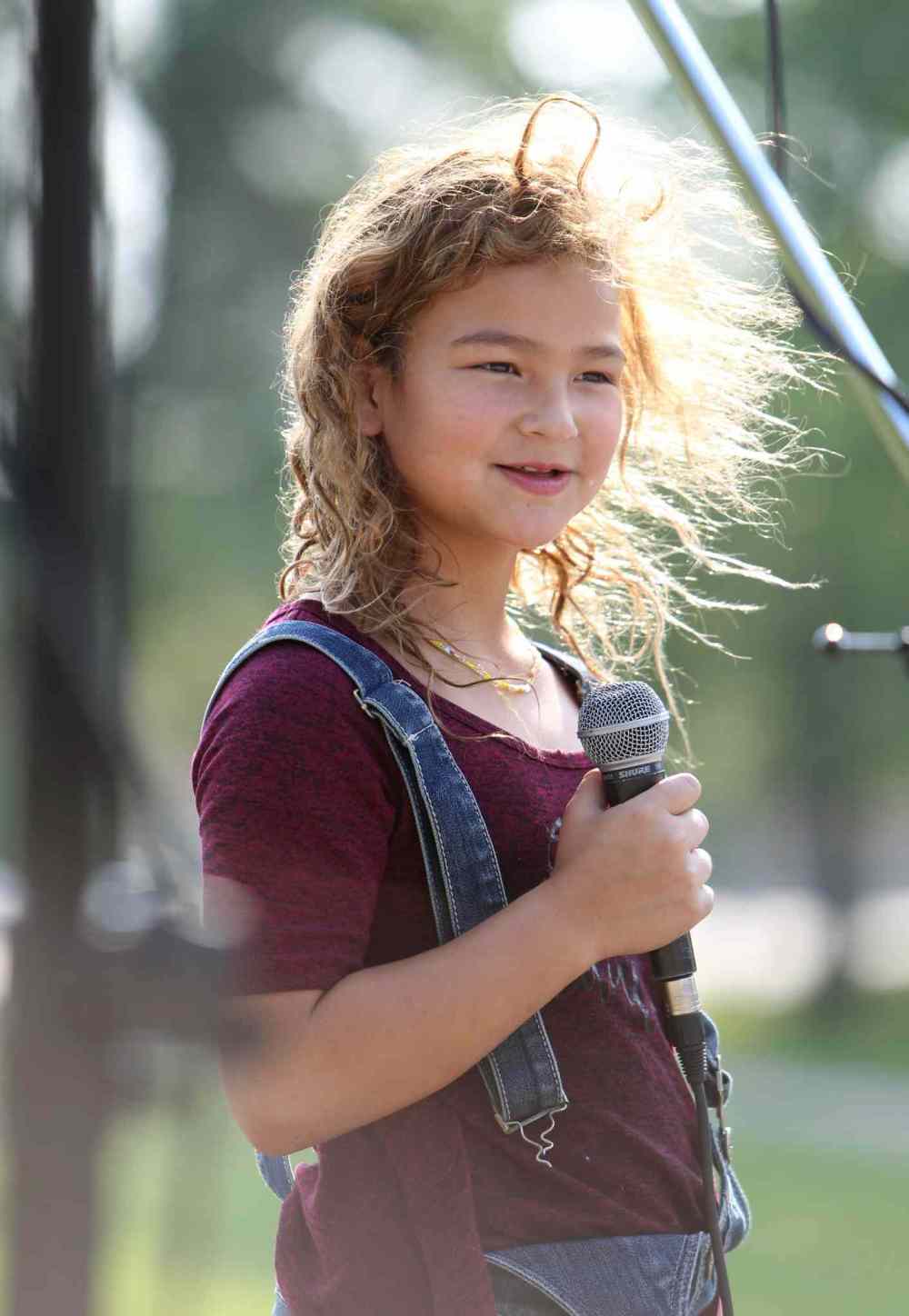 RUTH / BONNEVILLE WINNIPEG FREE PRESS
The first performer to take the stage was Jersey Siebrecht (9yrs) at Joe Zuken Park in Point Douglas Saturday for fundraising concert called - Comminities Building Communities with funds going towards North Point Douglas Women's Centre.
The producer for a fundraising concert was Matt Thorvaldson.
See Randy Turner story.
Aug 19, 2017