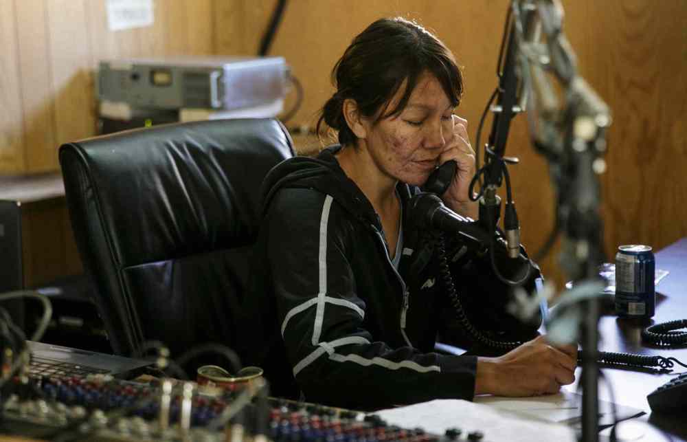 Mike Deal / Winnipeg Free Press
Vicki Okemow in the local radio station, where she makes community announcements and takes requests for songs she plays via YouTube on her laptop.