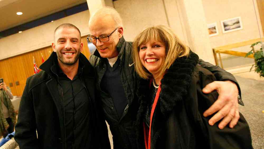 PHIL HOSSACK / Winnipeg Free Press - Left to right - Darcy Oake and his parents Scott and Anne celebrate after a city council vote approving the recovery centre at the Vimy Arena site Thursday. - January 25, 2018