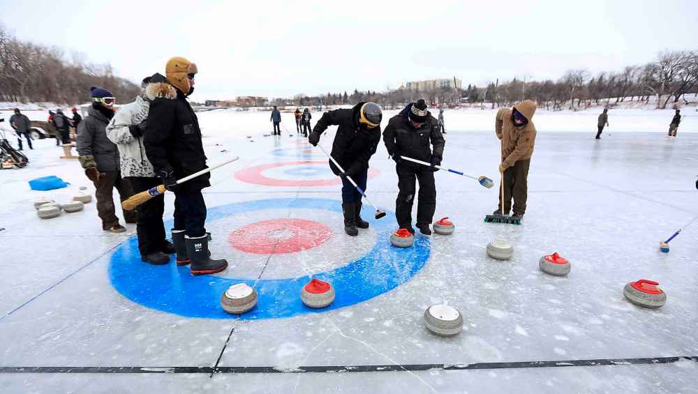 One of the signature winter events at The Forks is a curling bonspiel on the frozen river. (Trevor Hagan / Winnipeg Free Press)