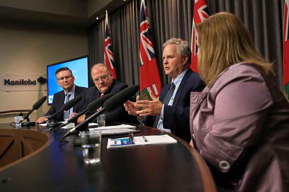 RUTH BONNEVILLE / WINNIPEG FREE PRESS
Dr. Brock Wright, CEO, Shared Health, answers questions from the media about the layout of the Health System Transformation Blueprint with Ian Shaw,, transformation management leader (far left),  Health, Minister Kelvin Goertzen, and Ms. Karen Herd, CA Deputy Minister of Health, at the Legislative Building Thursday.