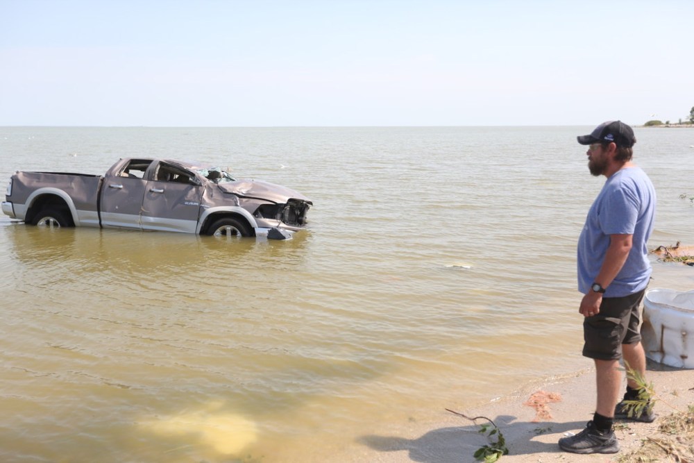 Melissa Verge/The Brandon Sun
Alonsa resident Shawn Gurke watches a truck floating in Lake Manitoba after the tornado hit on Aug. 3. A month later and the lake still needs to be cleaned up, local residents said.