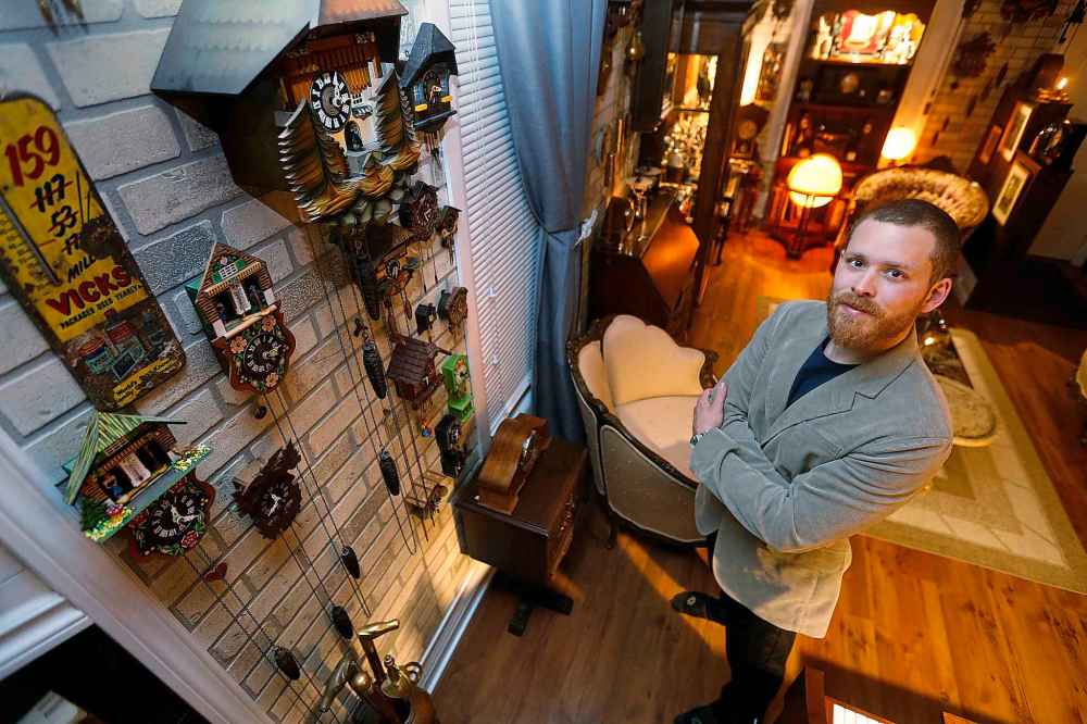Covering almost every square inch of wall space in Beilby's living room are dozens and dozens of hand-carved cuckoo clocks.