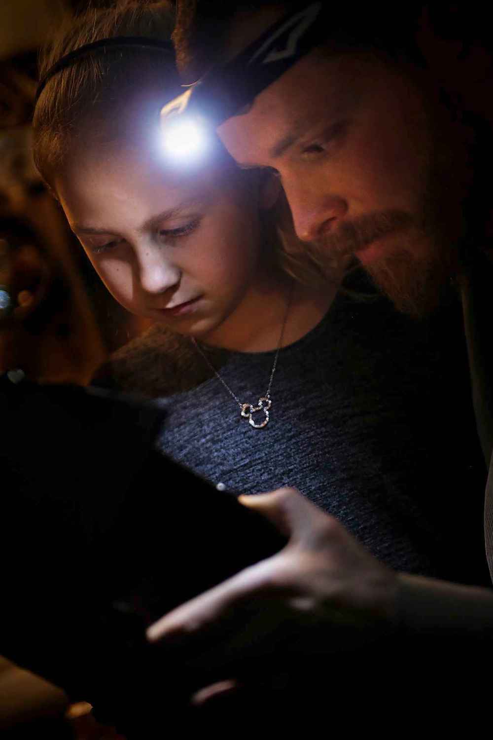 Beilby and his daughter Livia, 9, examine a specimen.