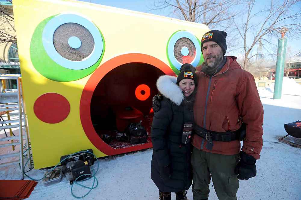 Jennie O'Keefe and Chris Pancoe with their award-winning warming hut, Huttie, at The Forks. (Trevor Hagan / Winnipeg Free Press)