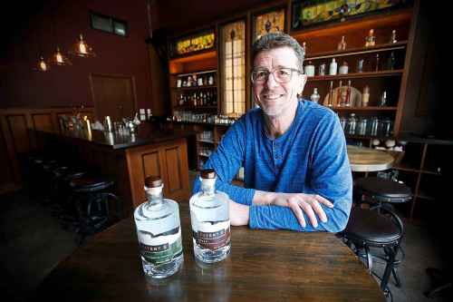 JOHN WOODS / WINNIPEG FREE PRESS
Brock Coutts, co-owner of Patent 5 Distillery in his Alexander Avenue tasting room, which features reclaimed wood from the St. Regis Hotel.